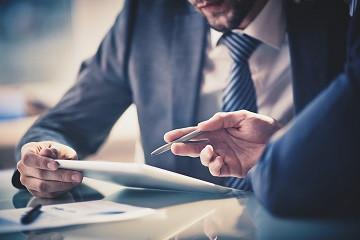 Business leaders reviewing technology strategy